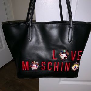 Black bag with embroidered and jeweled logo